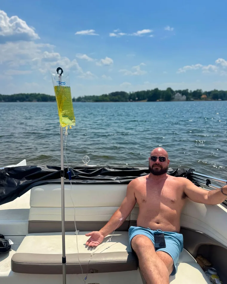 A client receiving an IV on a boat